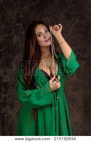 Beautiful Woman In Green Abaya.