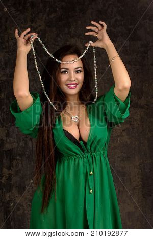 Beautiful Woman In Green Abaya.