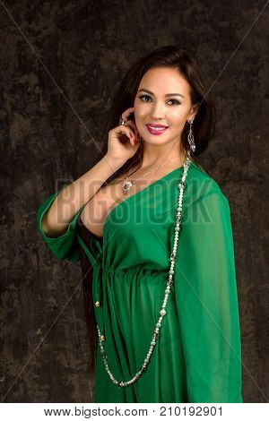 Beautiful Woman In Green Abaya.