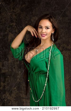 Beautiful Woman In Green Abaya.