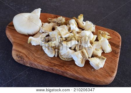Fried Oyster Mushrooms On Wooden Cutting Board