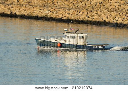 New Bedford Massachusetts USA - October 21 2017: Fishing boat Honi-Do leaving New Bedford harbor