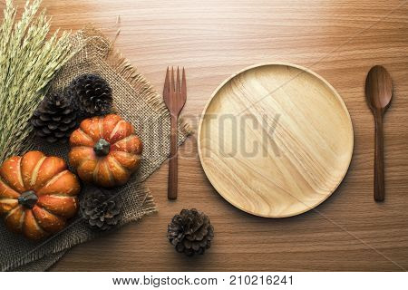 food wooden dinner dish and spoon, fork and decor top view