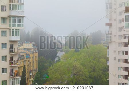 Aerial view of Tonnelnaya street between two apartment buildings in the morning fog Sochi Russia