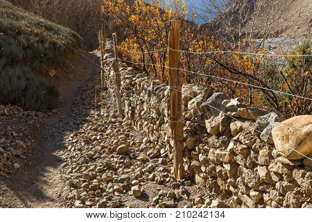 mountain trail, fence mesh and stone, Himalayas Nepal