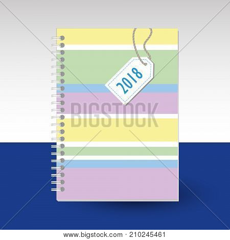 vector cover of diary or notebook with ring spiral binder - format A5 - layout brochure concept - cute pastel colored with quilted tag and horizontal differently wide stripes