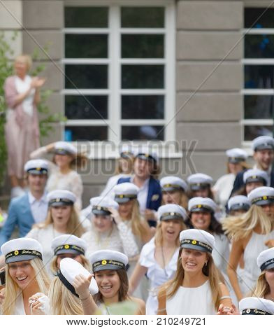 Stockholm Sweden - Jun 13 2017: Closeup Of Group Of Smiling Students Wearing White Graduation Caps A