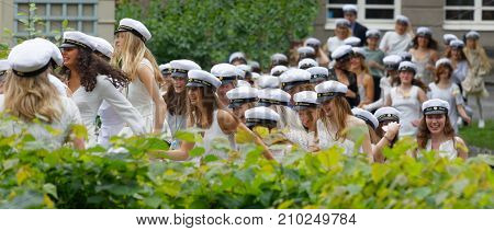 Stockholm Sweden - Jun 13 2017: Smiling Students Wearing White Graduation Caps After Graduation At T