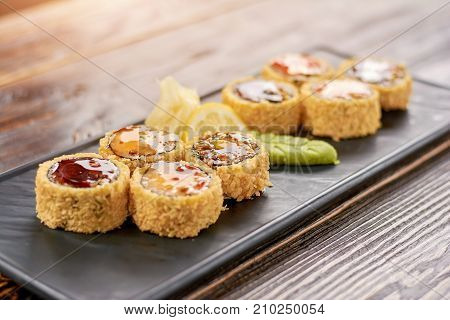 Sushi rolls with eel and avocado. Unagi furay sushi rolls. Traditional japanese food.