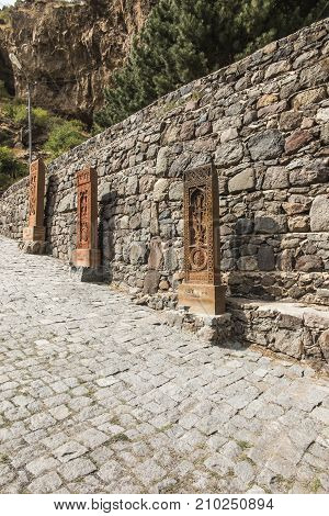 Traditional Armenian stone crosses and rocks around the Geghard monastery in Armenia