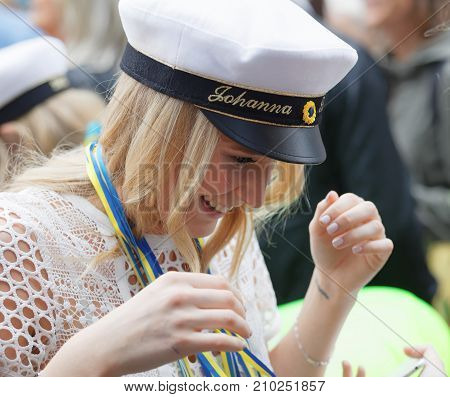 Stockholm Sweden - Jun 13 2017: Smiling Blonde Students Girl Wearing White Graduation Cap And White 