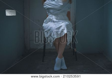 mentally ill girlwith a straitjacket in a Psychiatric