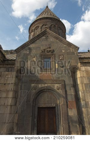 The ancient Christian temple Geghard in the mountains of Armenia