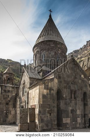 The ancient Christian temple Geghard in the mountains of Armenia