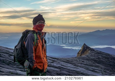 Laban Rata,Sabah,Borneo-March 12,2016:Adventure climber standing near of Mount Kinabalu's summit Low's Peak during sunrise at Ranau,Sabah Borneo,Malaysia.