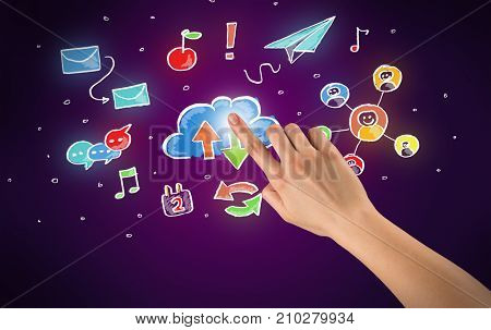 Female hand toucing mixed media icons with purple background