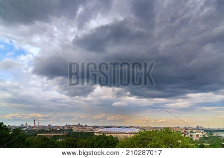 Moscow, Russia - June 12, 2017: Terrible clouds over Luzhniki Stadium. View of Moscow from the observation platform on Sparrow Hills