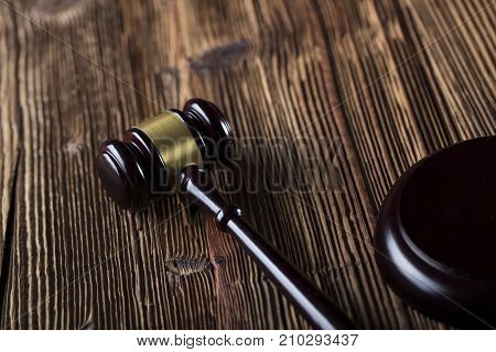 Gavel. Auction and business concept.  Gavel on the wooden background.