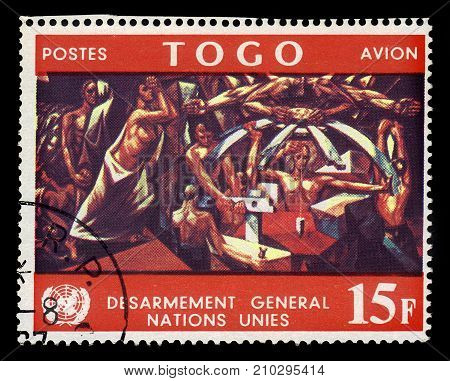 TOGO - CIRCA 1967: A stamp printed in Togo shows mural by spanish artist Jose Vela Zanetti in United Nations Conference Building, circa 1967