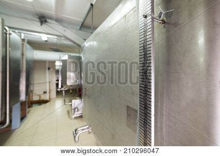 Storage of liquid with stainless steel tanks. Tanks have a rectangular shape.
