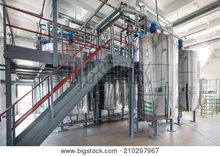 Steel chrome cisterns. Yeast mixture preparation system. Plenty of pipelines and pumps.