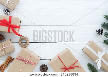 Christmas composition - Christmas present gifts box and decoration elements on white wooden background. Creative Flat layout and top view composition with border and copy space design.