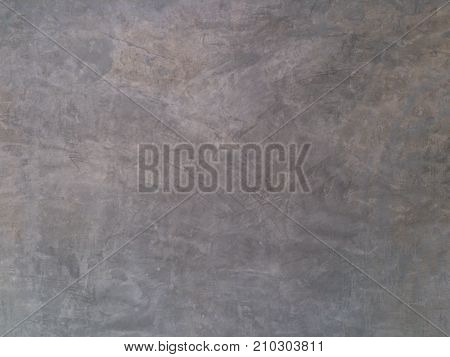 The wall is polished and beautiful in front of the wall in the background.