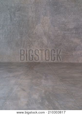 The wall is polished and beautiful in front of the wall in the background.