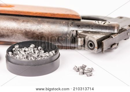 Box With Metal Air Gun Pellets And Air Gun With Wooden Kundak Gunstock Above White Background