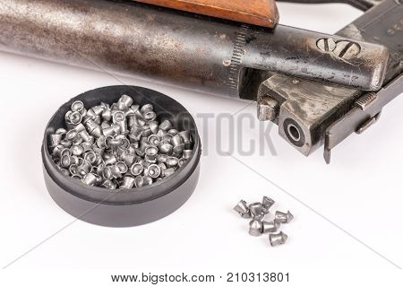 Box With Metal Air Gun Pellets And Air Gun With Wooden Kundak Gunstock Above White Background