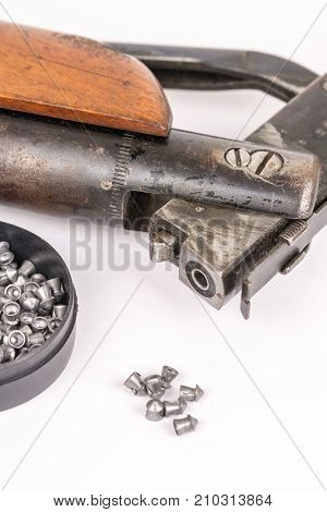 Box With Metal Air Gun Pellets And Air Gun With Wooden Kundak Gunstock Above White Background