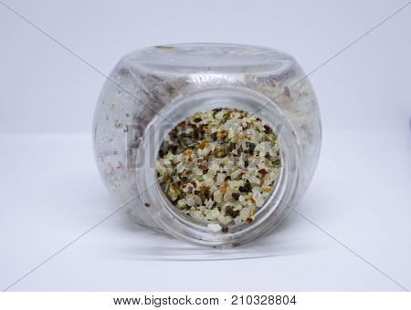 Spilled coarce sea salt with different spices