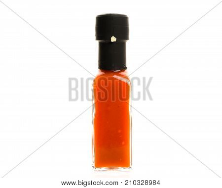 Hot Chili Sauce Glass Bottle On White Background.