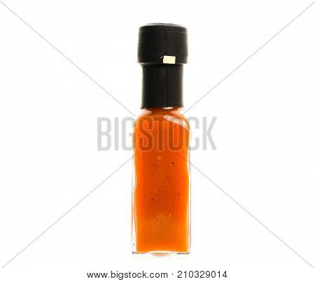 Hot Chili Sauce Glass Bottle On White Background.
