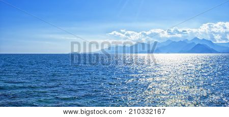 Panoramic view on Mediterranean Sea and mountains from a harbor in old town Kaleici. Antalya Turkey.