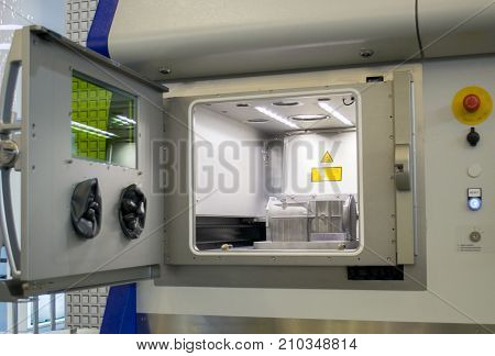 A model with supports created in a laser sintering machine stays in the working chamber. DMLS, SLM, SLS technology. Concept of 4.0 industrial revolution. Progressive modern additive technology.