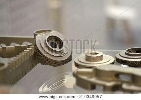 Object printed on metal 3d printer. A model created in a laser sintering machine close-up. DMLS, SLM, SLS technology. Concept of 4.0 industrial revolution. Progressive modern additive technology.