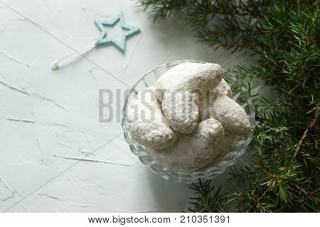 Vanilkipferl - vanilla crescents traditional Christmas cookies in Germany Austria Czech Republic. Homemade cookies in Christmas or New Year's decor. Selective focus.