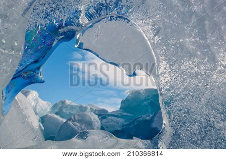 Endless blue ice hummocks in winter on the frozen Lake Baikal. Russia