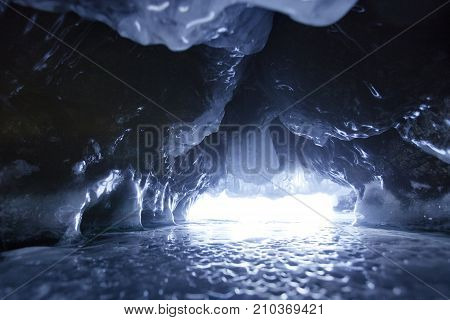 Icicles In Cave. Lake Baikal. Winter Landscape