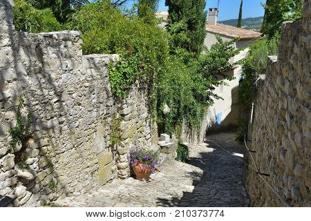 France Provence. Narrow street in the medieval village Vaison la Romaine