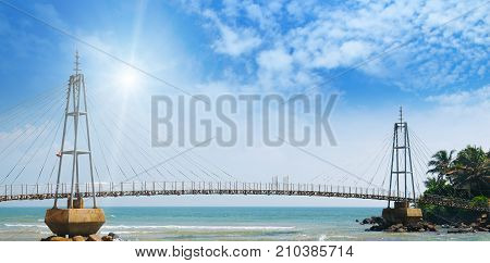 bridge to island ocean and sun in blue sky (Matara Sri Lanka)