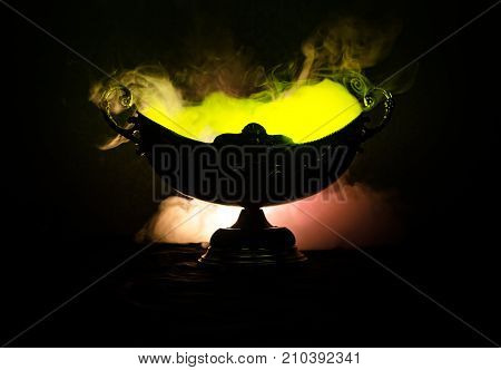 Vase Handmade On A Dark Shelf Isolated On Black.