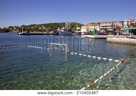 Water polo on the beach in fishermans village Sumartin on Brac island in Croatia