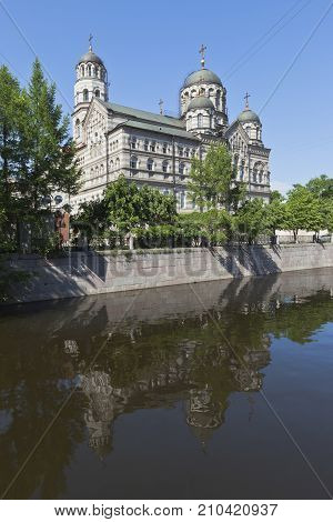 View of the St. John's Stauropegial Convent with a reflection in the river Karpovka. Saint-Petersburg, Russia