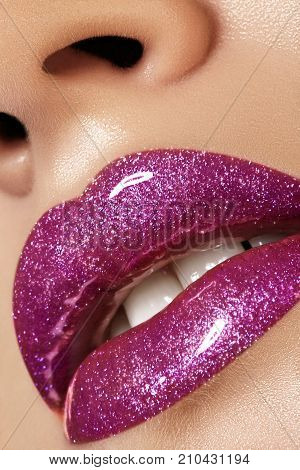 Glamour magenta gloss lip make-up. Fashion makeup beauty shot. Close-up female sexy full lips with celebrate pink gloss lipstick