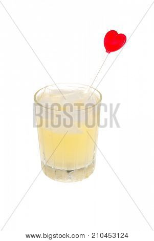 Margarita mixed in a glass with a heart stir stick