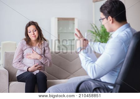 Pregnant woman visiting psychologist doctor