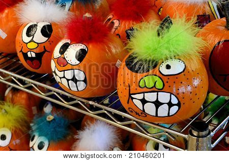 Crazily painted pumpkins provide festive fall decorations