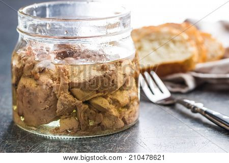 Cod liver in oil in jar.